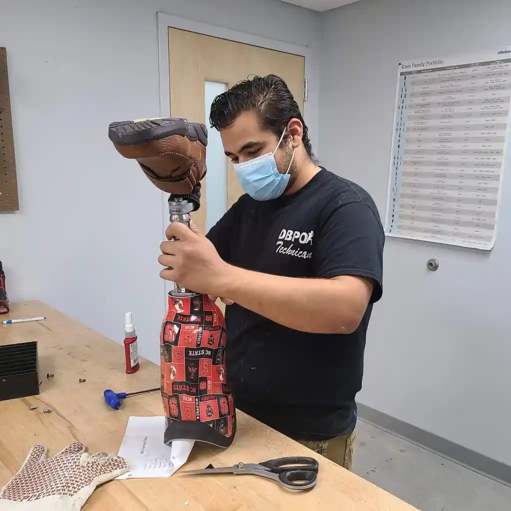 Technician adjusting a prosthetic