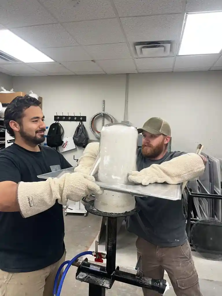 Technicians collaborating on fabrication
